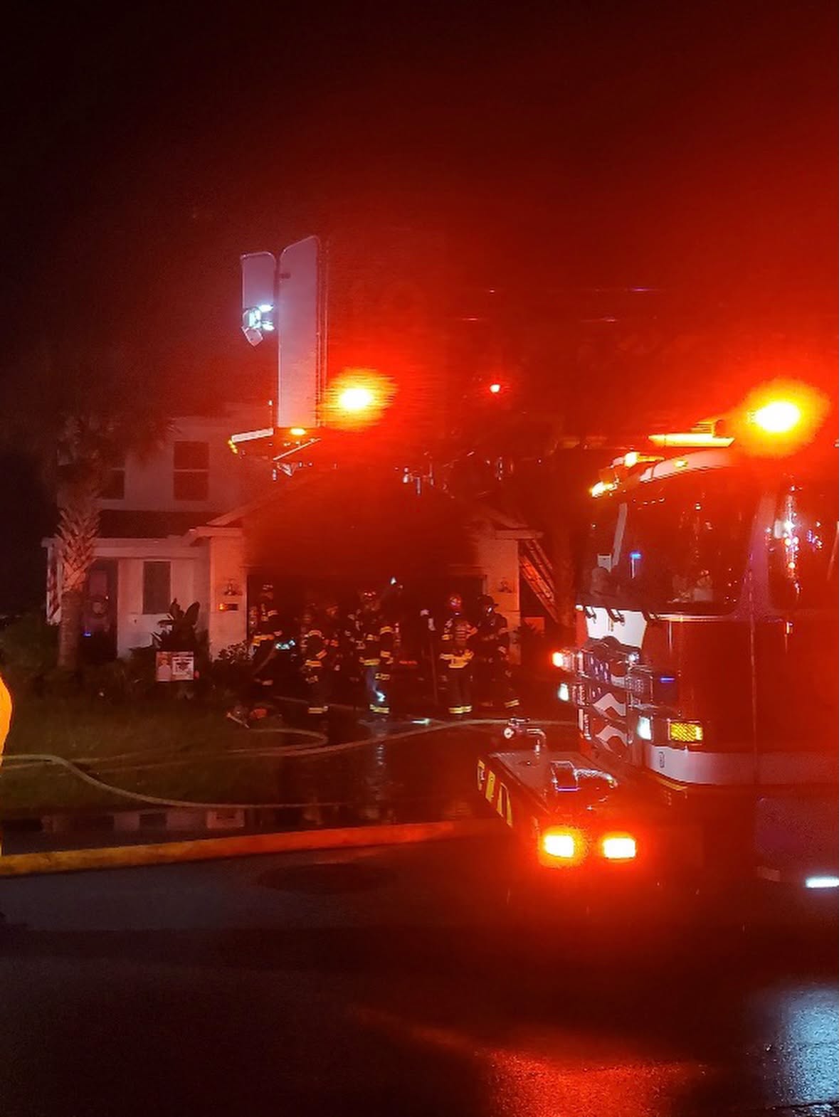 Firefighters and emergency vehicles responding to a garage fire in Beachwalk.